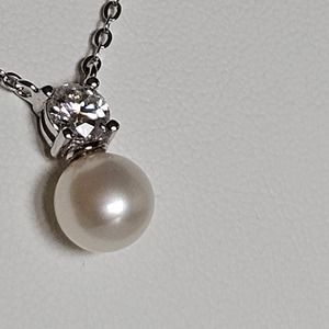 Pearl Brilliance: Celebrate by giving the gift of elegance, .5ct Moissanite